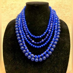 Multi layer necklace and earrings set in striking blue